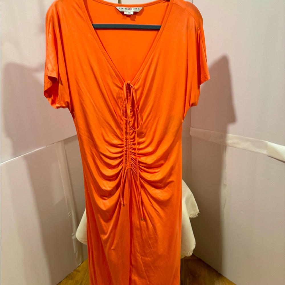Gorgeous Trina Turk knit dress. Front flattering shirting. Size M